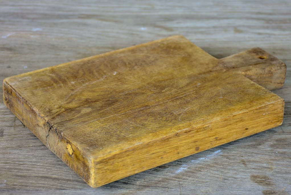 Small antique French cutting board with repairs