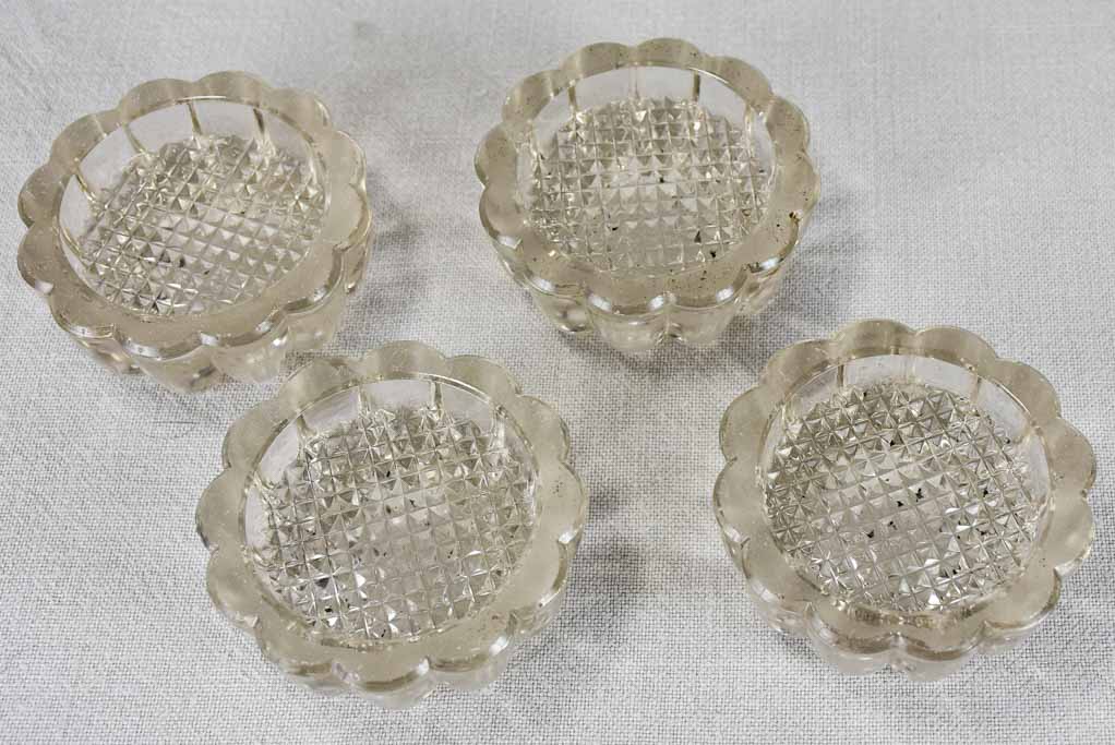 Set of four vintage French glass table risers