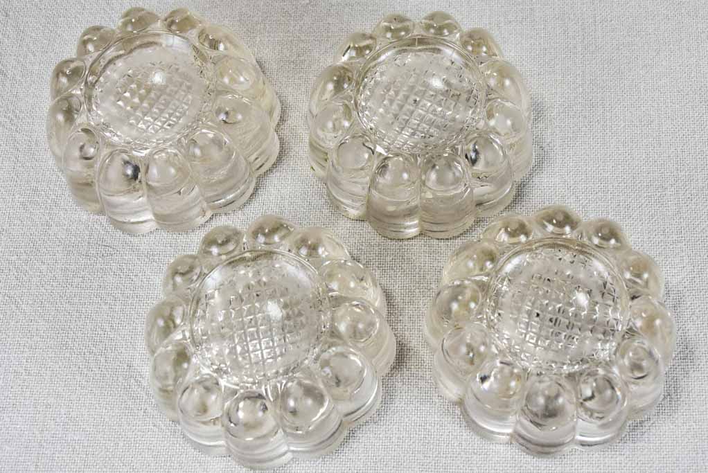 Set of four vintage French glass table risers