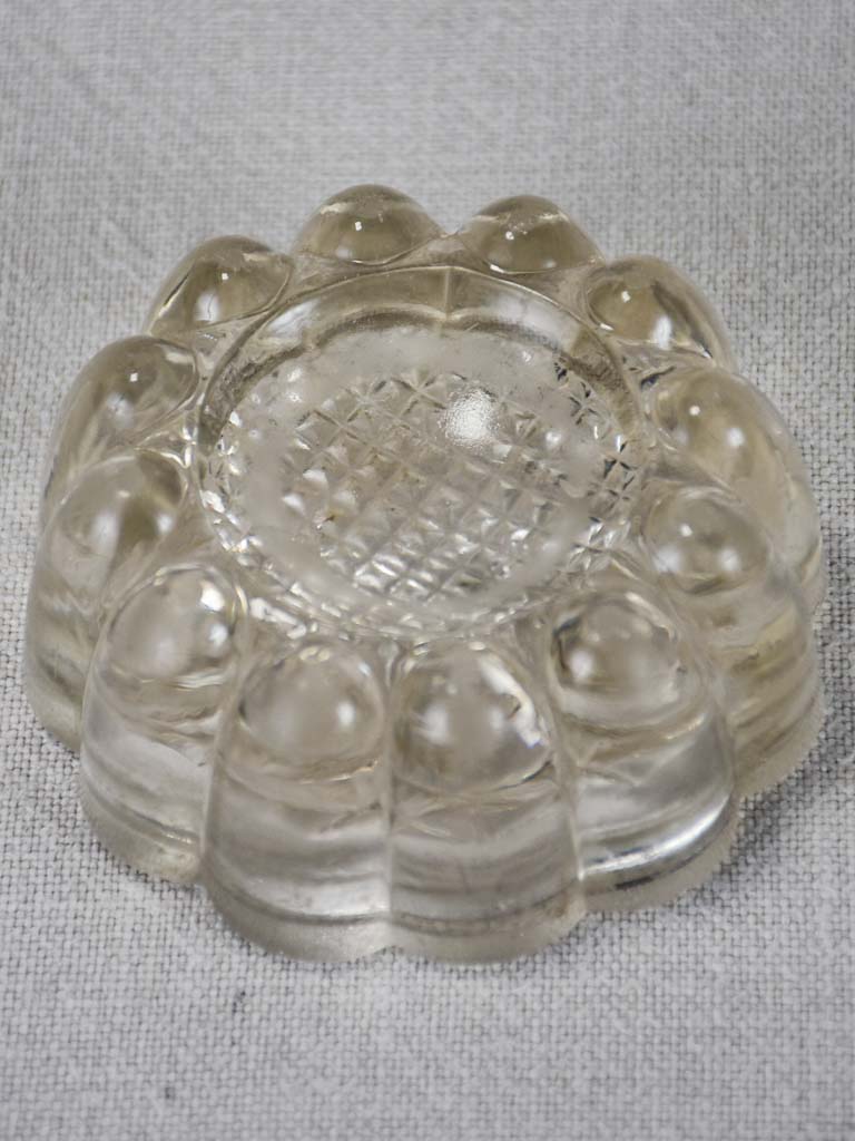 Set of four vintage French glass table risers