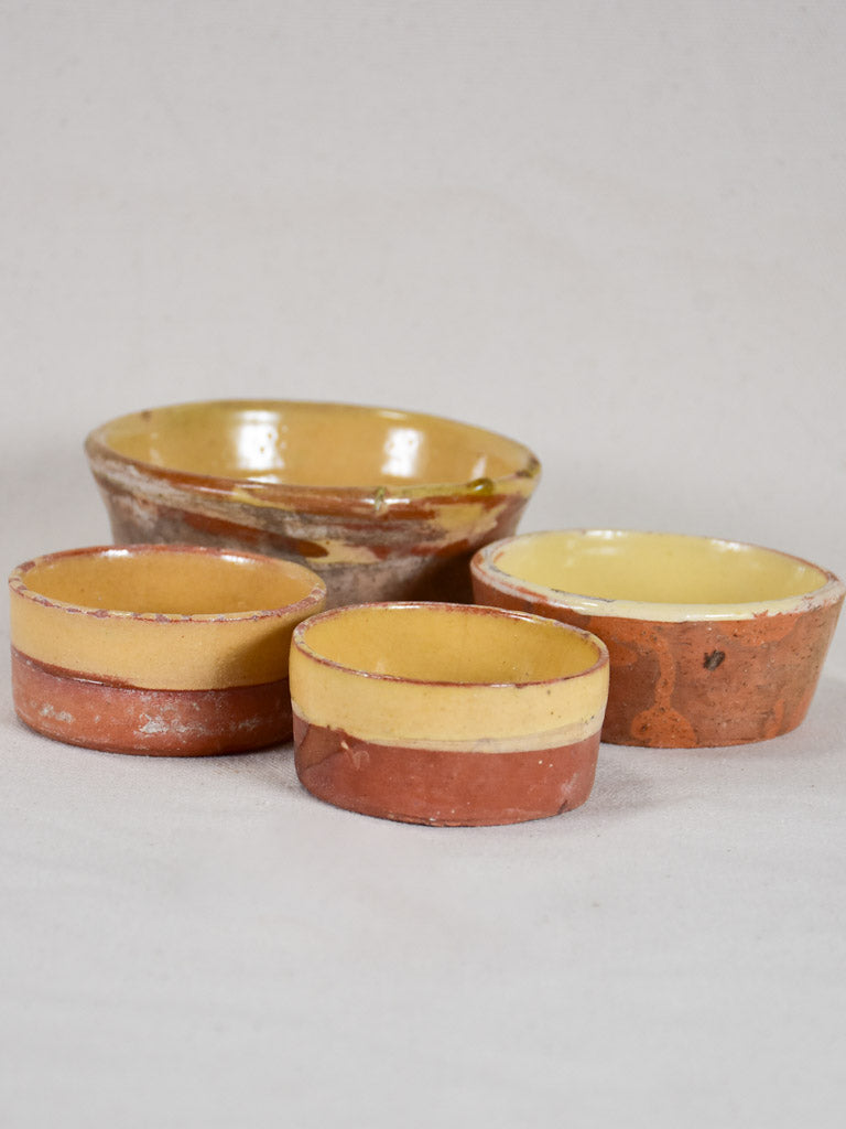 Collection of four antique French terracotta cheese strainers