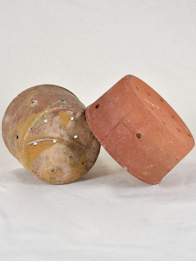 Two antique French terracotta cheese strainers