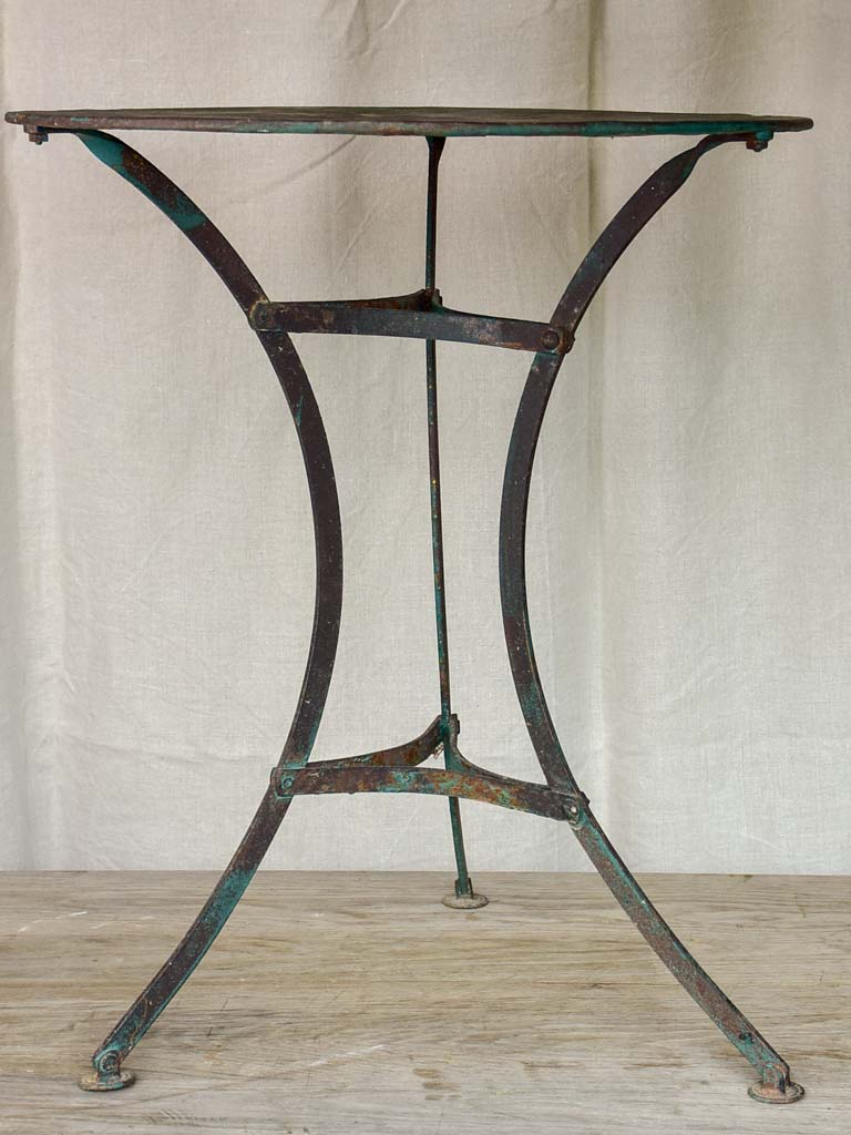 Round antique French garden table with green patina