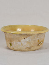 Antique French teracotta cheese strainer with yellow glaze