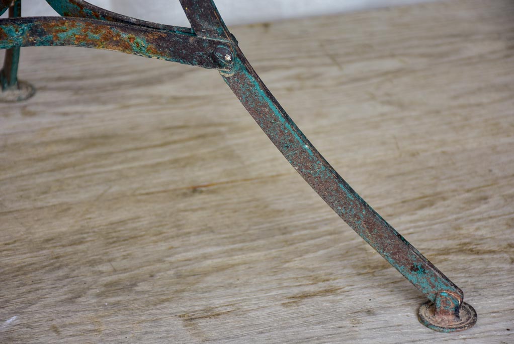 Round antique French garden table with green patina