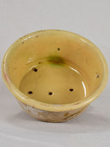 Antique French teracotta cheese strainer with yellow glaze