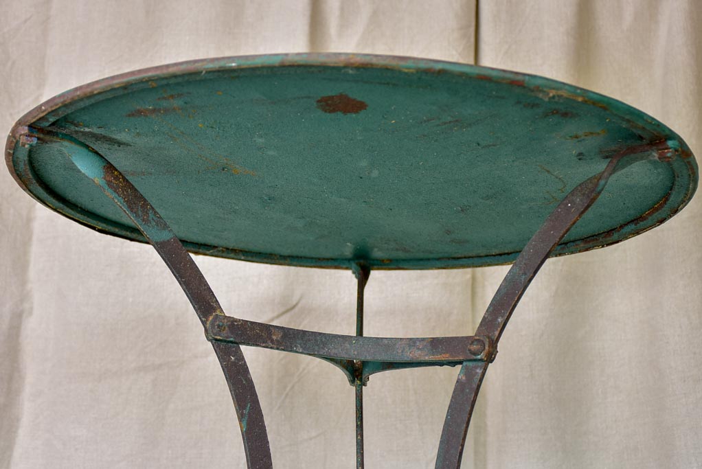 Round antique French garden table with green patina