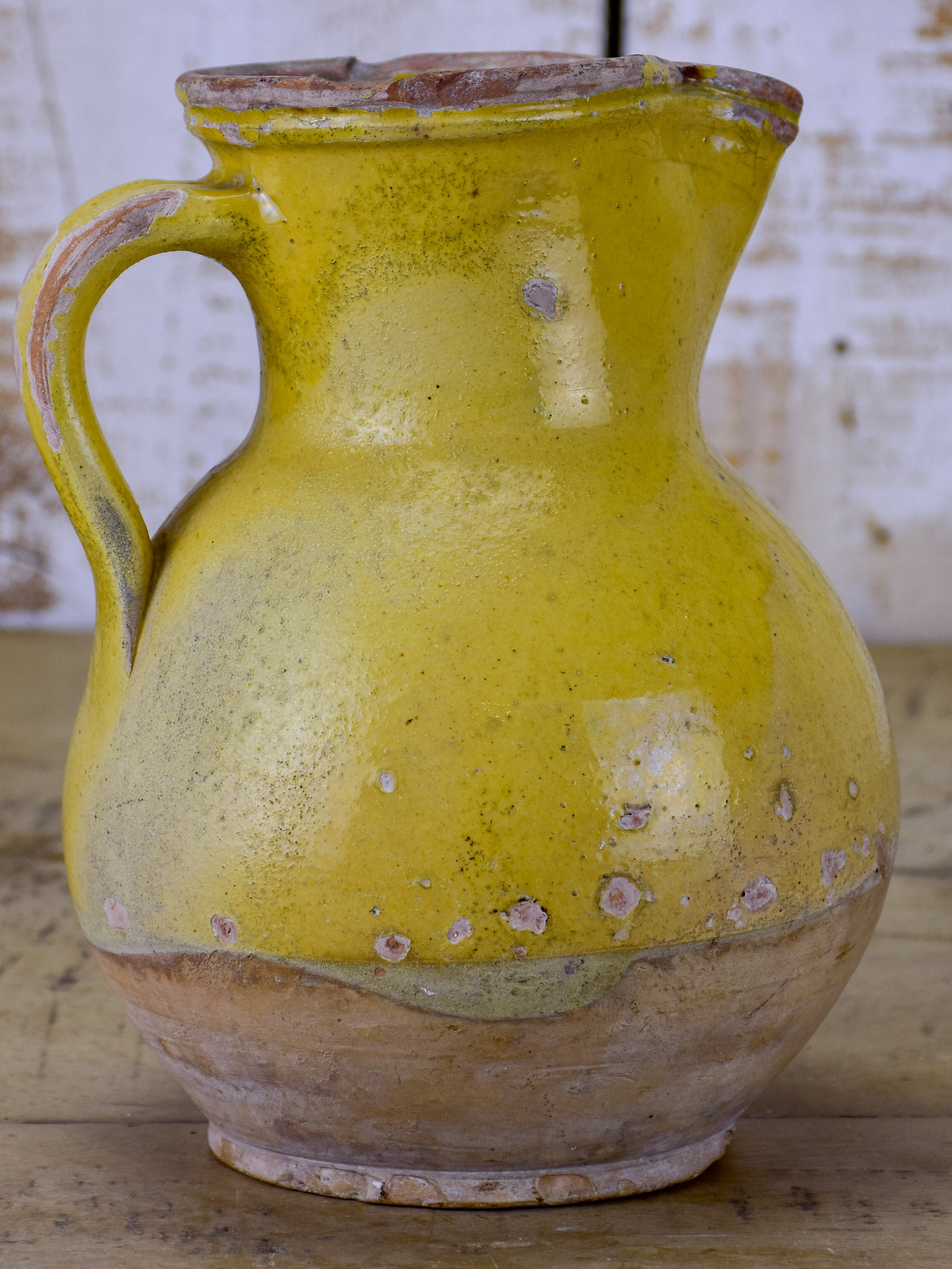 19th Century French pitcher with yellow glaze