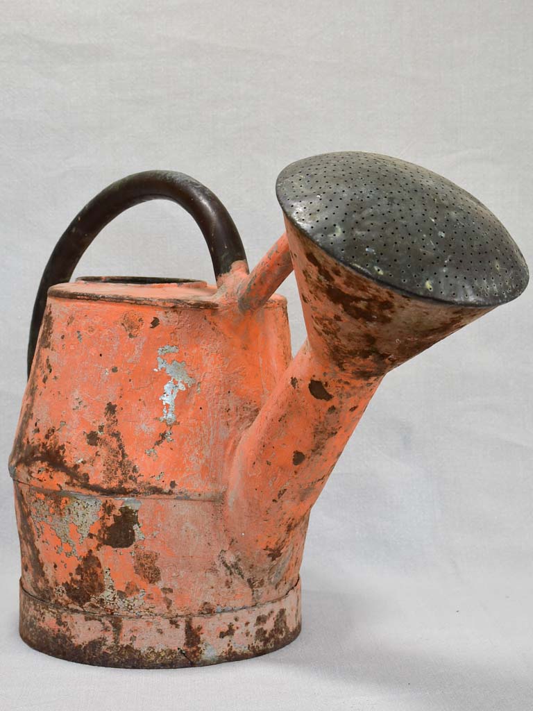 Nineteenth-century French watering can with orange patina