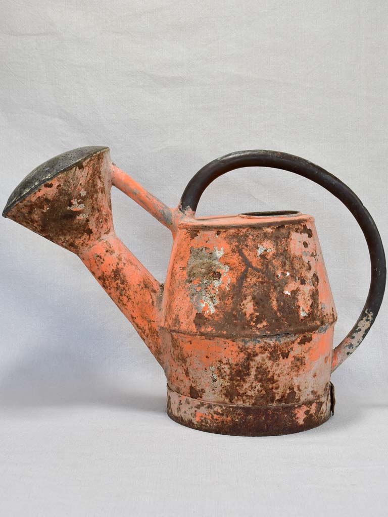 Nineteenth-century French watering can with orange patina