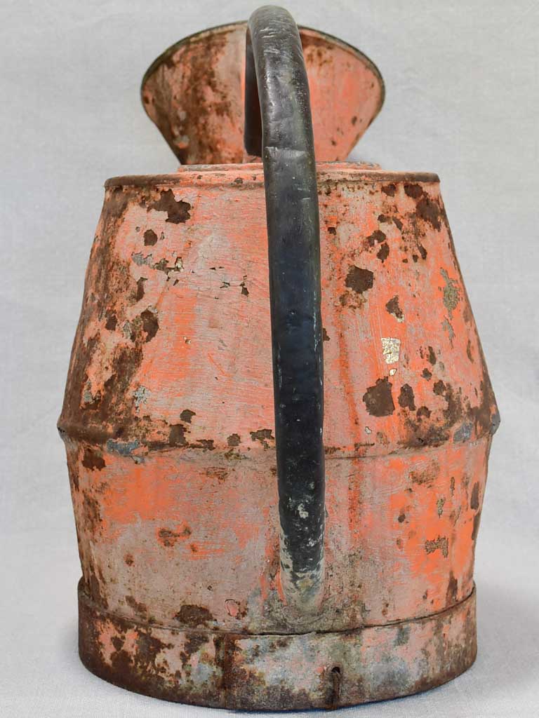 Nineteenth-century French watering can with orange patina