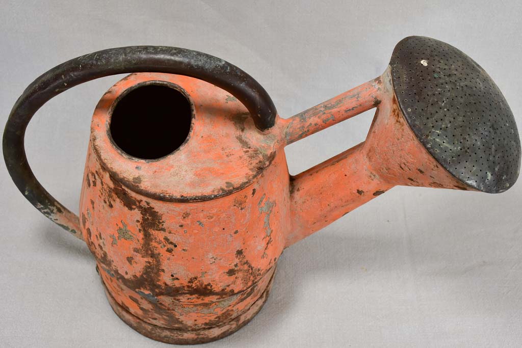 Nineteenth-century French watering can with orange patina