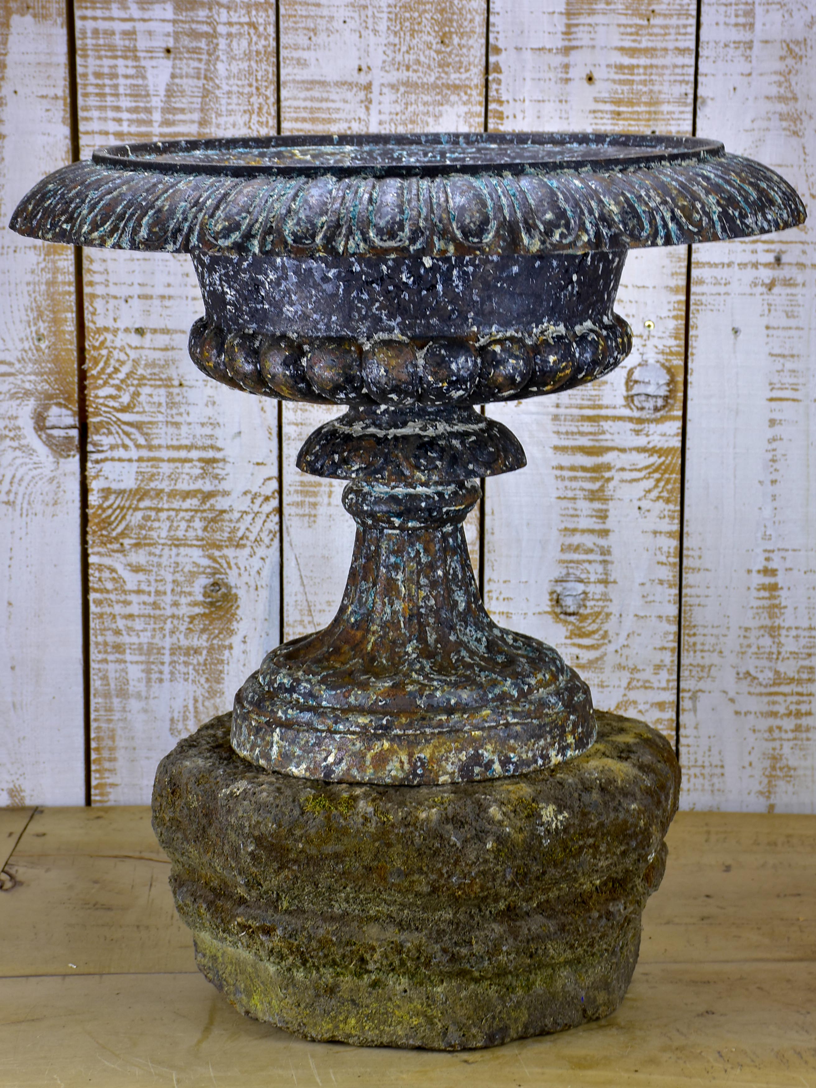 Large antique French medici urn mounted on a stone pedestal