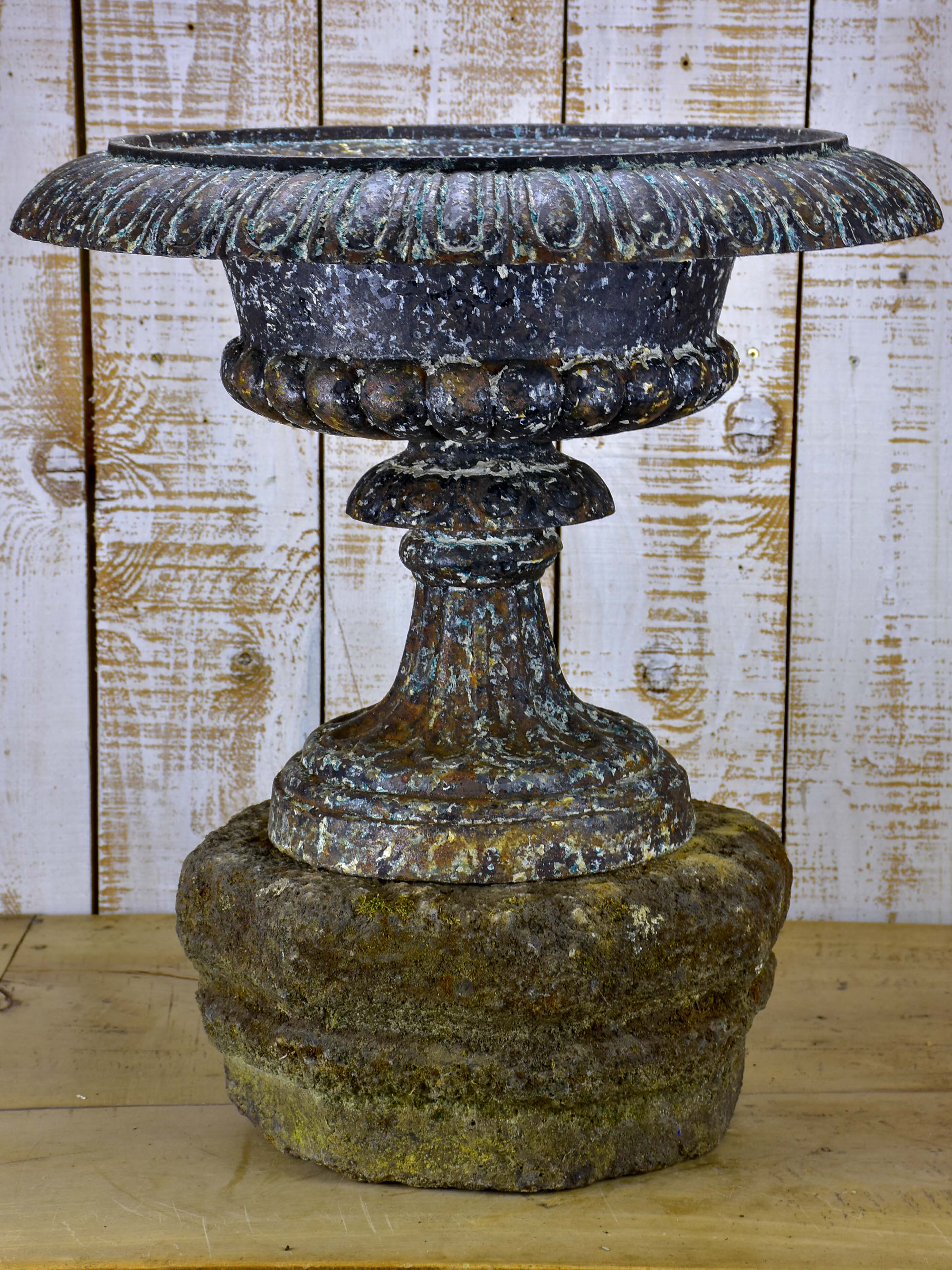 Large antique French medici urn mounted on a stone pedestal