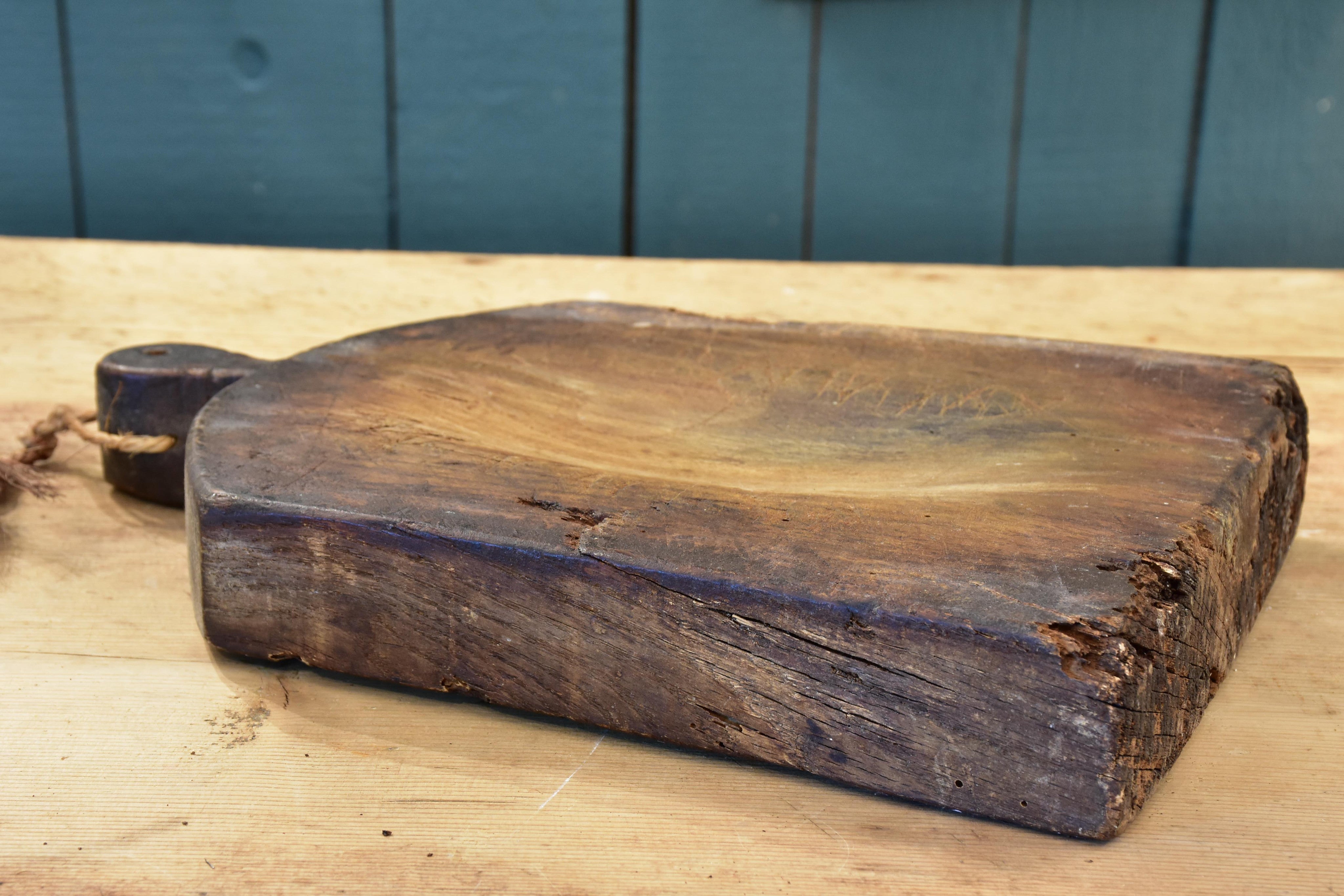 Cutting board with curved top