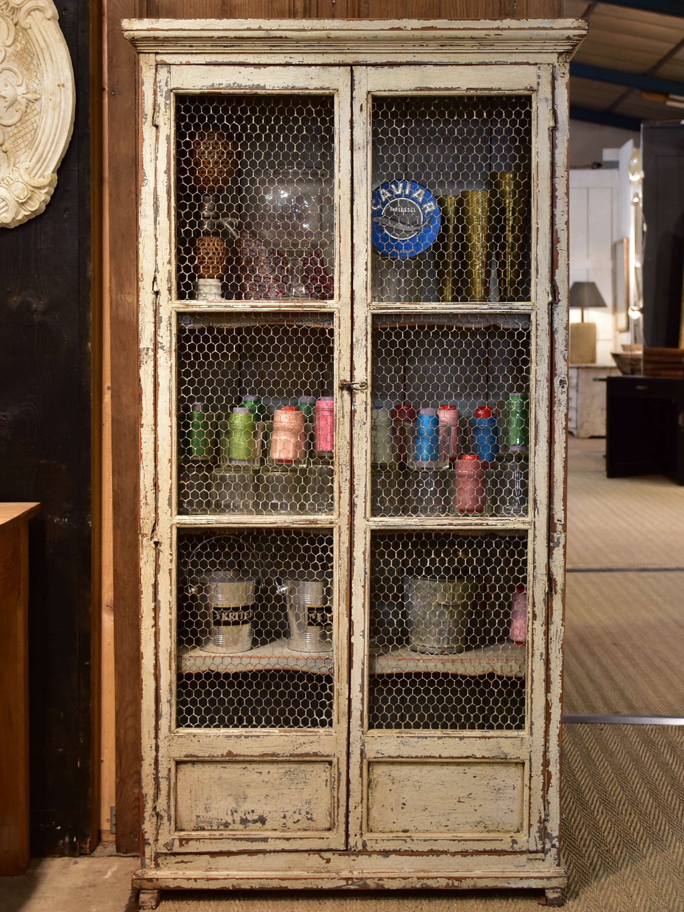 Rustic French armoire with grillwork doors