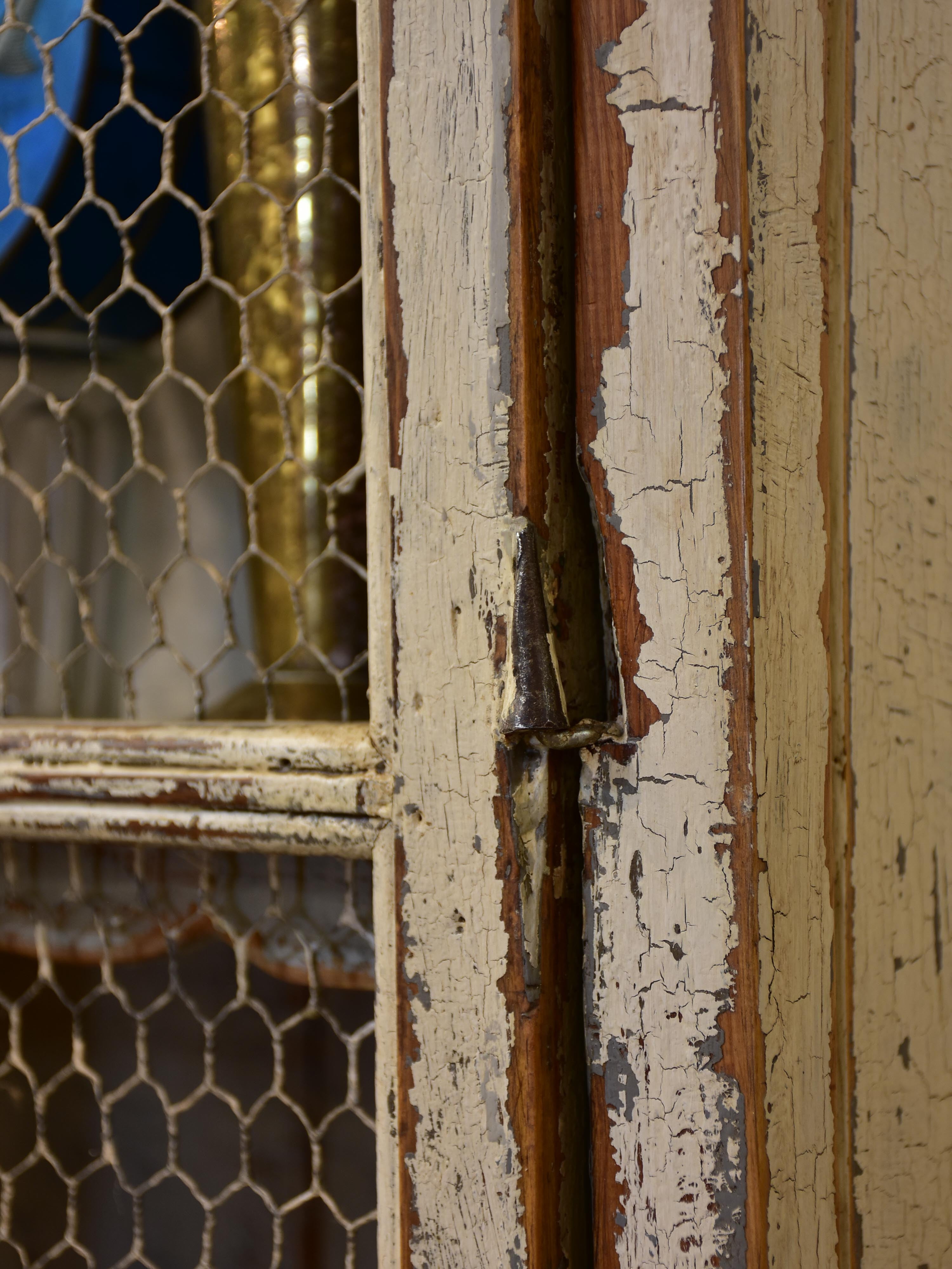 Rustic French armoire with grillwork doors