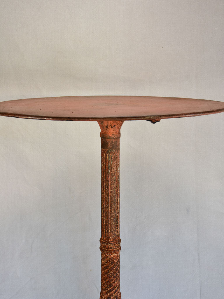 Nineteenth-century French garden table with salmon red patina