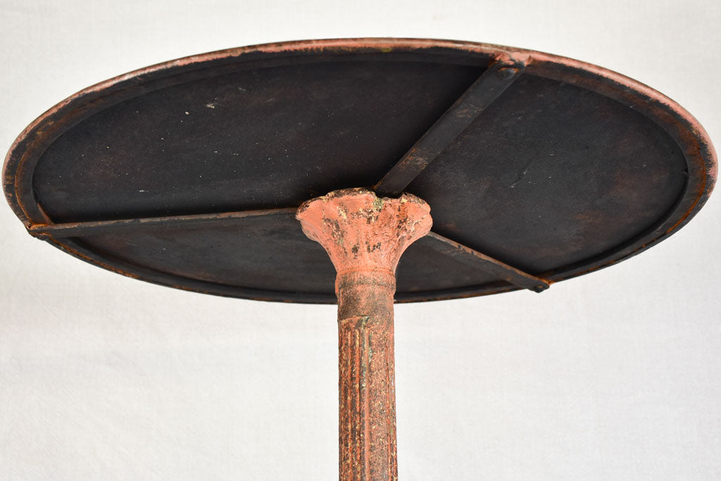 Nineteenth-century French garden table with salmon red patina