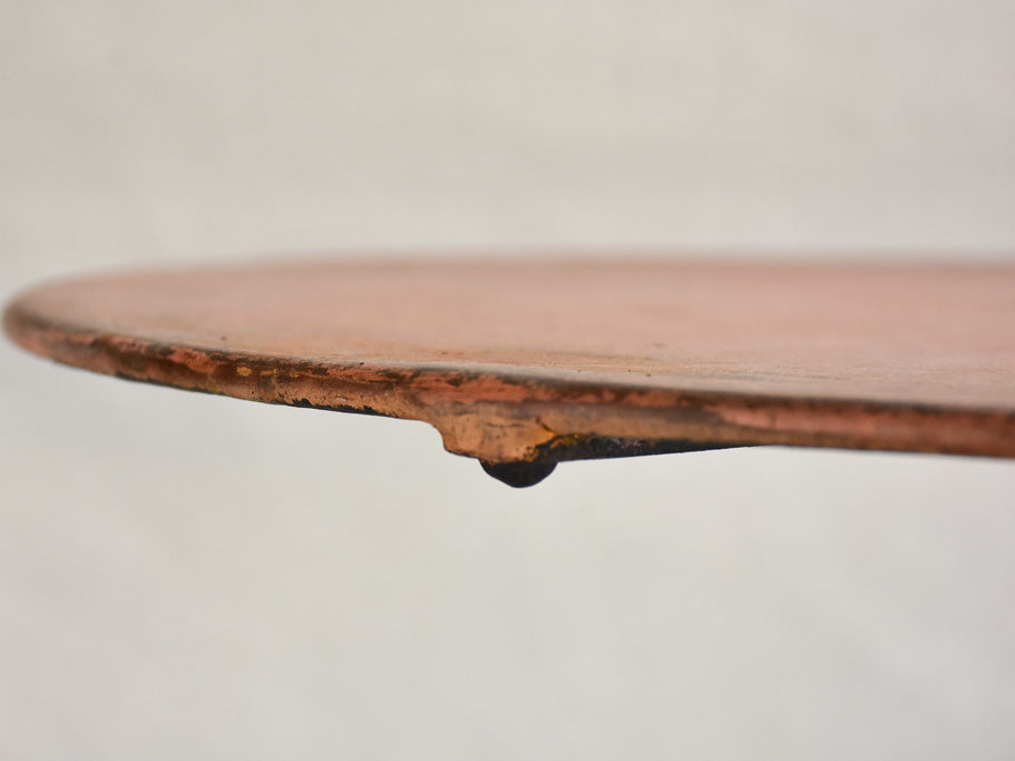 Nineteenth-century French garden table with salmon red patina