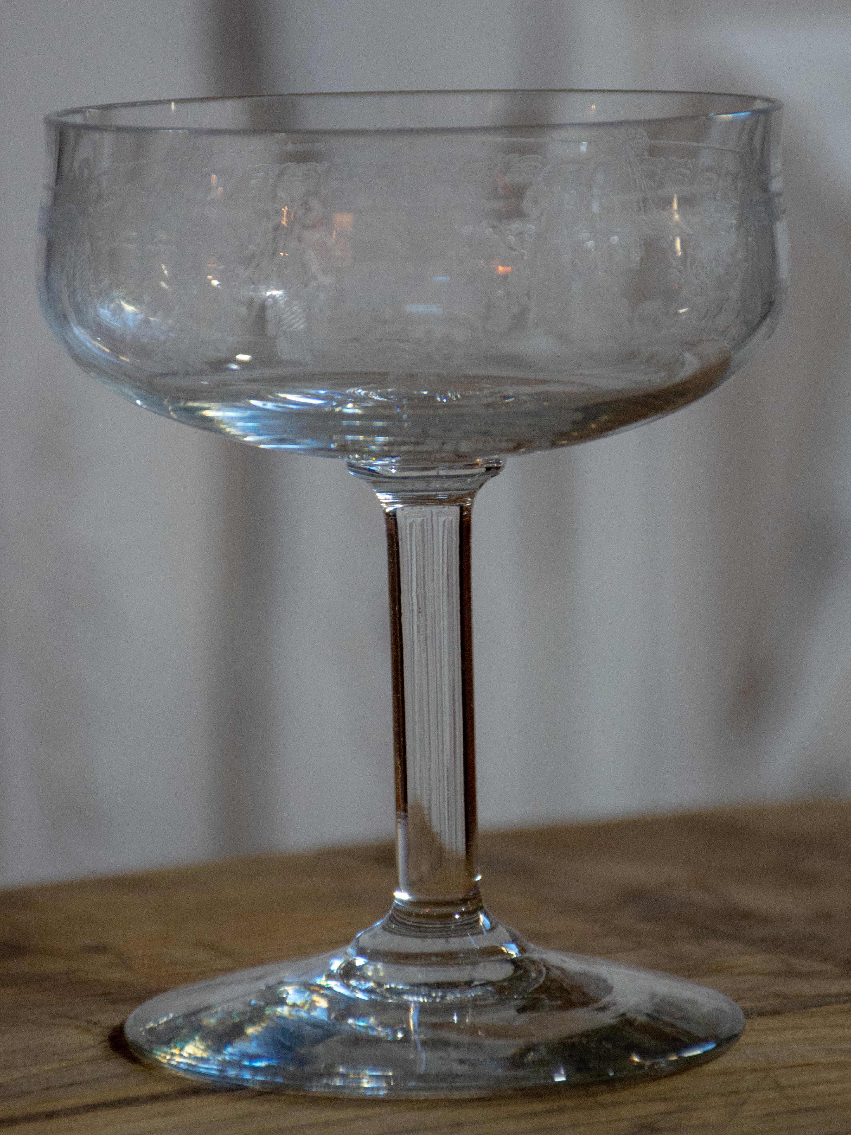 Six antique French champagne cups engraved with bows and garlands