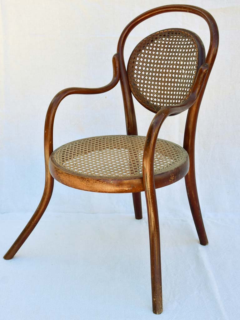 Antique French children's bentwood and cane armchair