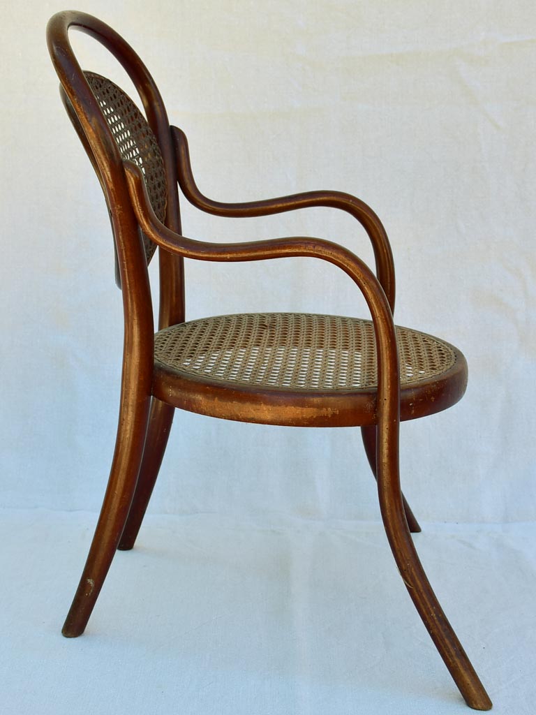 Antique French children's bentwood and cane armchair