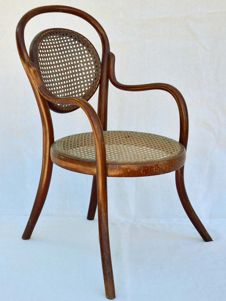 Antique French children's bentwood and cane armchair