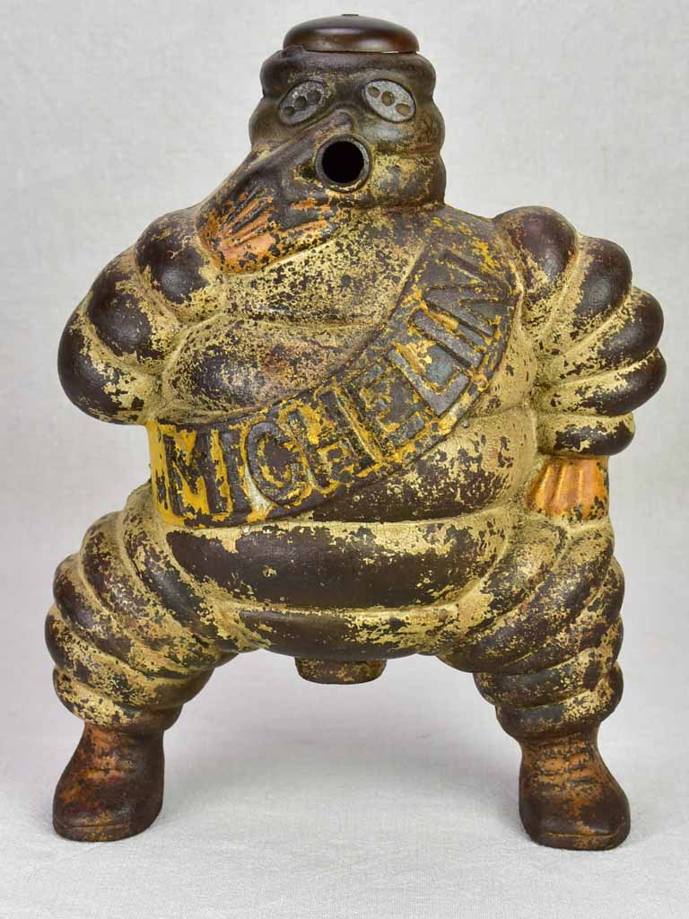 Early 20th century Michelin man, Bibendum from a large air compressor