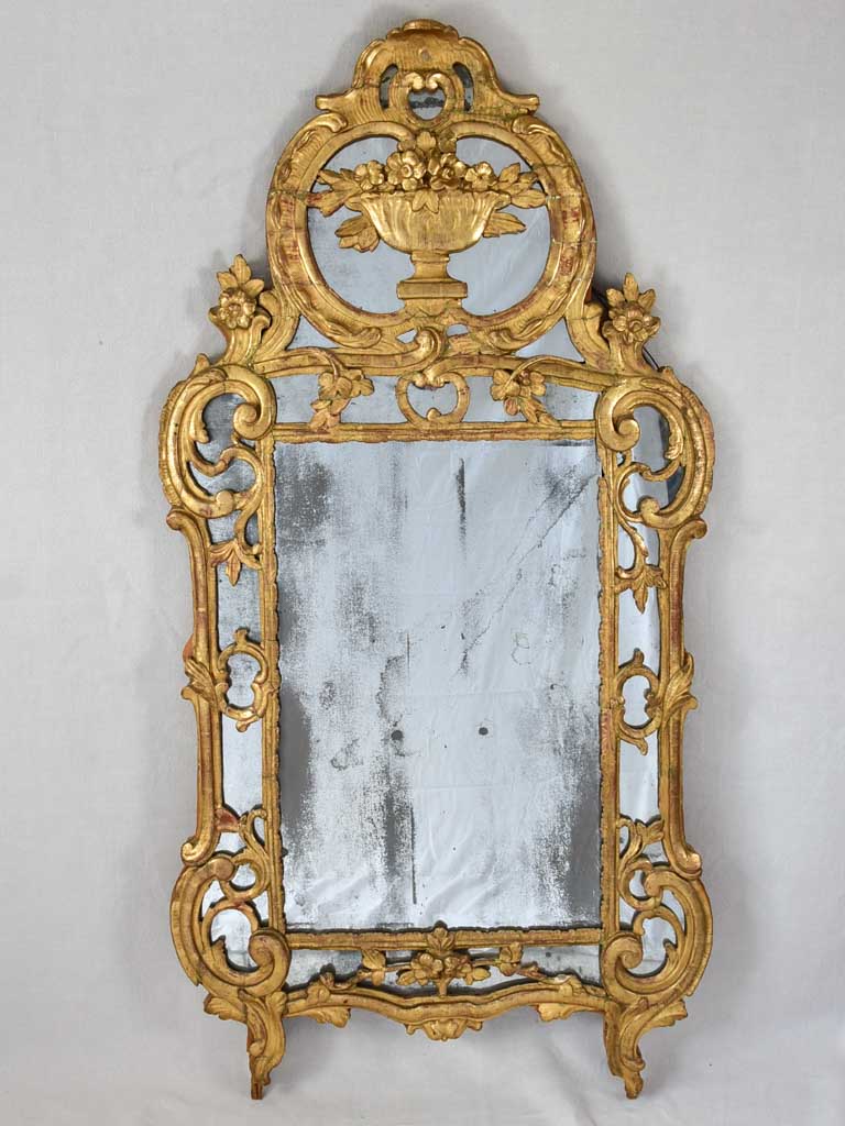 Large 18th century French gilt mirror with flower basket pediment 29½"x 59½"