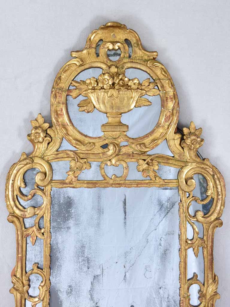 Large 18th century French gilt mirror with flower basket pediment 29½"x 59½"