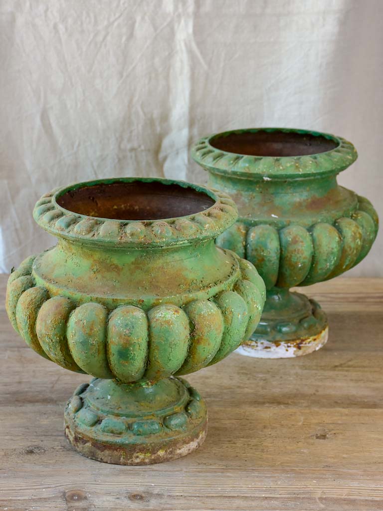 Pair of cast iron French antique garden urns with green patina