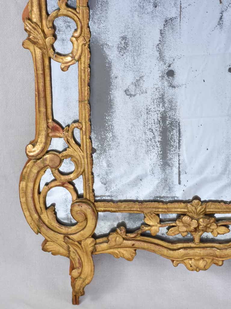 Large 18th century French gilt mirror with flower basket pediment 29½"x 59½"