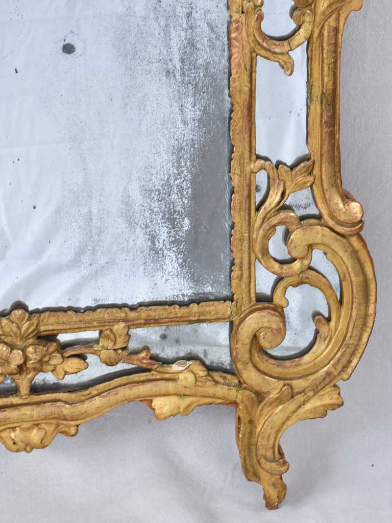 Large 18th century French gilt mirror with flower basket pediment 29½"x 59½"