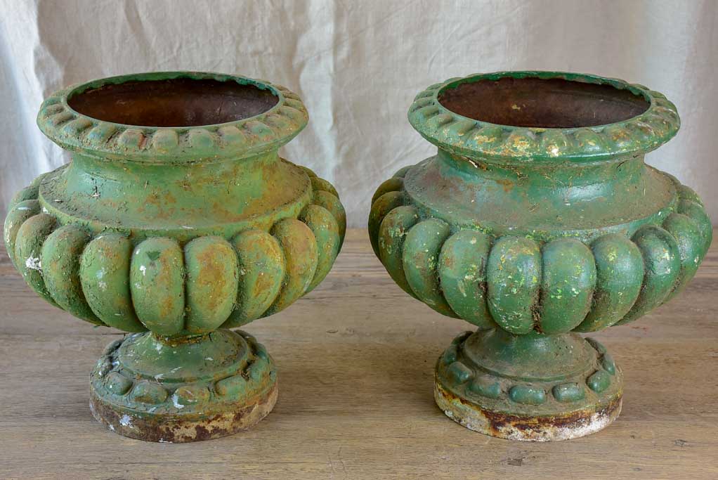 Pair of cast iron French antique garden urns with green patina