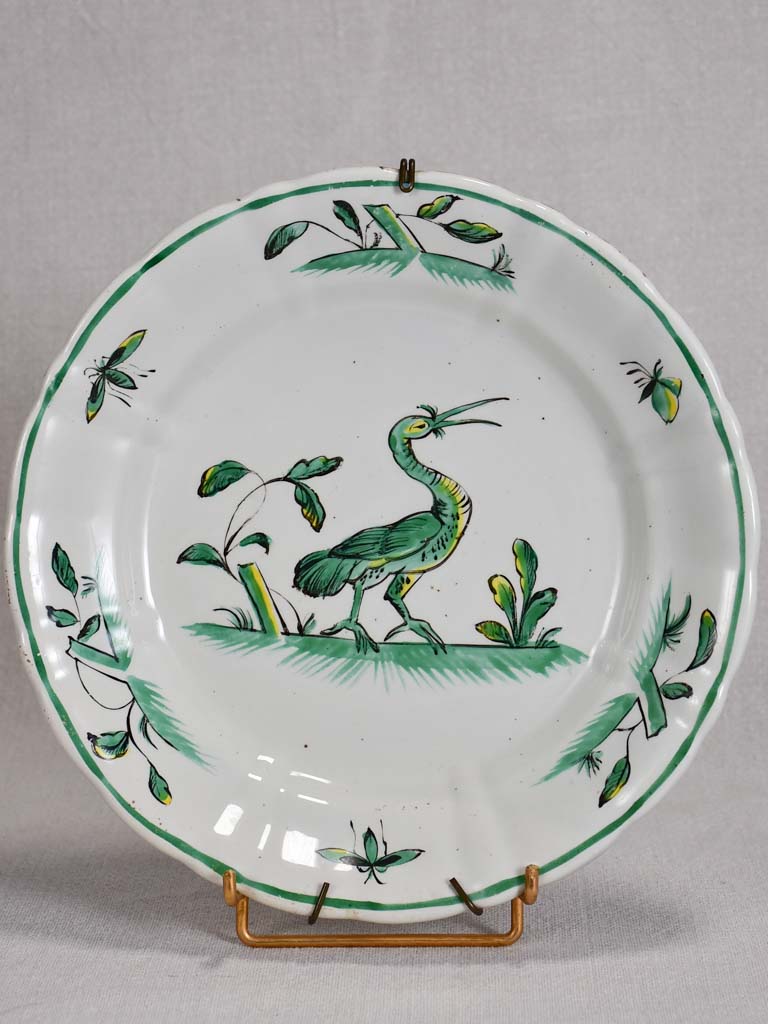 1950's Moustiers plate hand-painted with green foliage and a bird 9½"