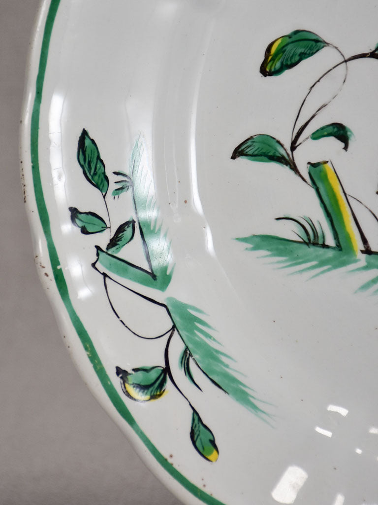 1950's Moustiers plate hand-painted with green foliage and a bird 9½"