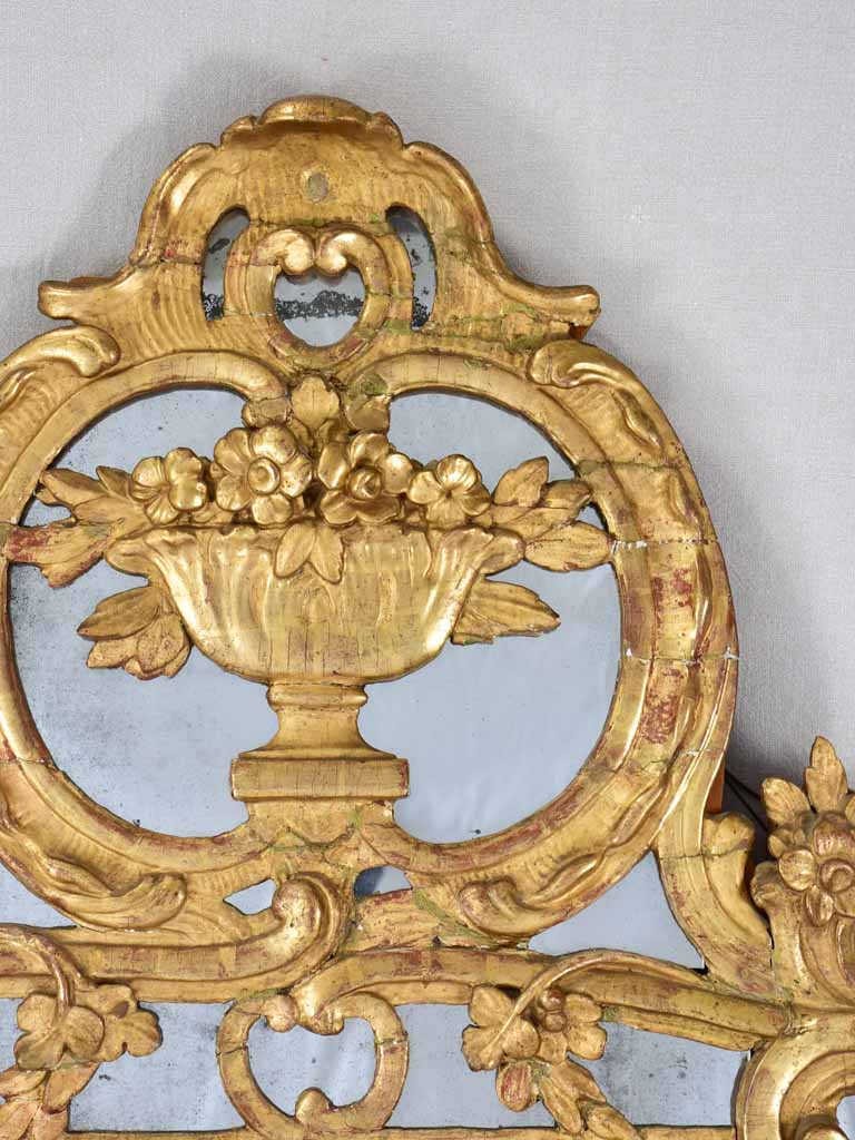 Large 18th century French gilt mirror with flower basket pediment 29½"x 59½"