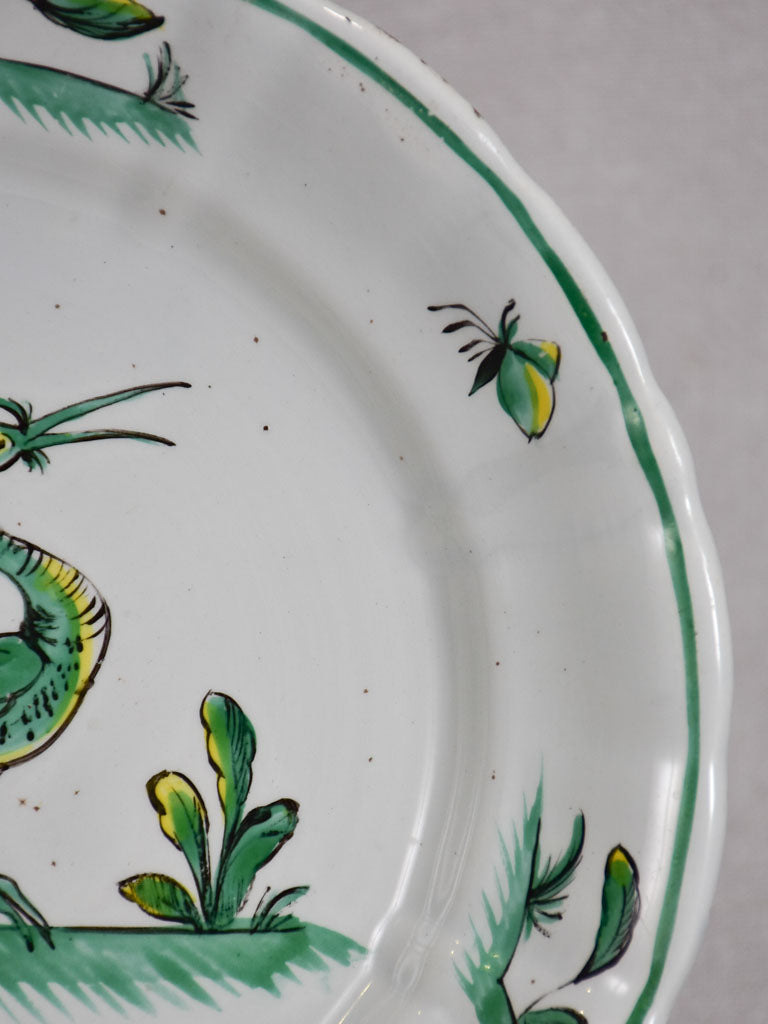 1950's Moustiers plate hand-painted with green foliage and a bird 9½"