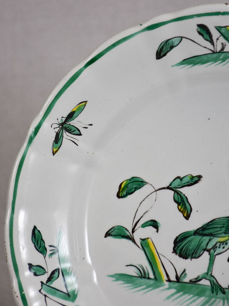 1950's Moustiers plate hand-painted with green foliage and a bird 9½"