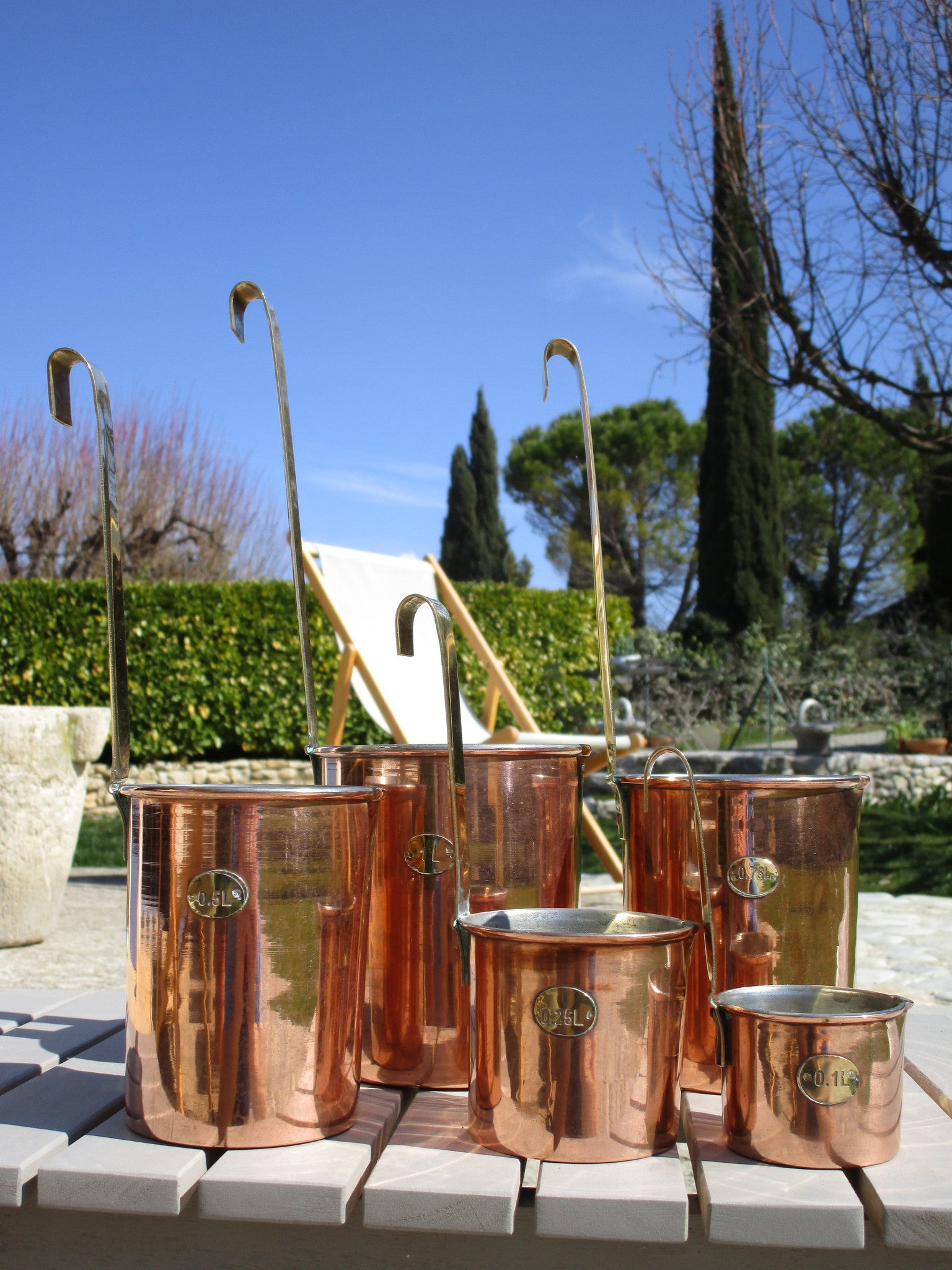 Set of five chef's French copper measuring cups