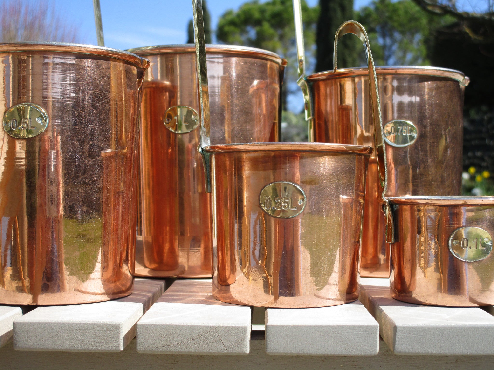 Set of five chef's copper measuring cups