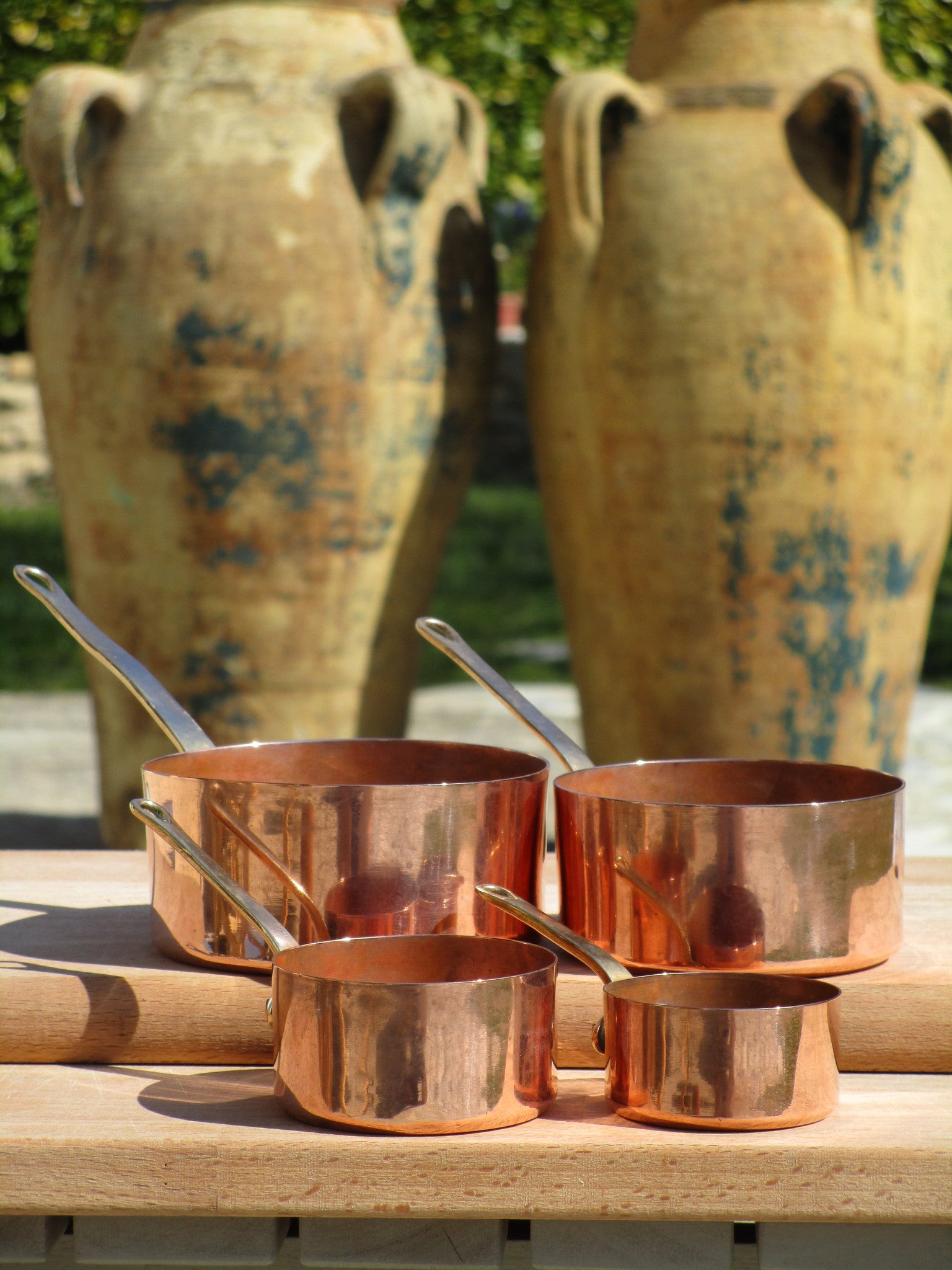 Set of four chefs miniature copper saucepans