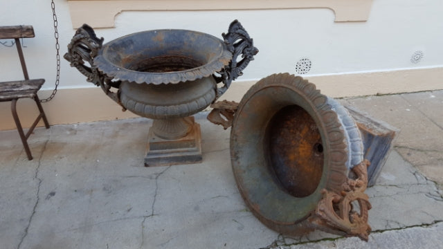 Pair of extra large antique French cast iron Medici urns with overarching handles