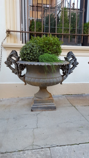 Pair of extra large antique French cast iron Medici urns with overarching handles