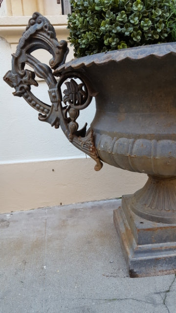 Pair of extra large antique French cast iron Medici urns with overarching handles