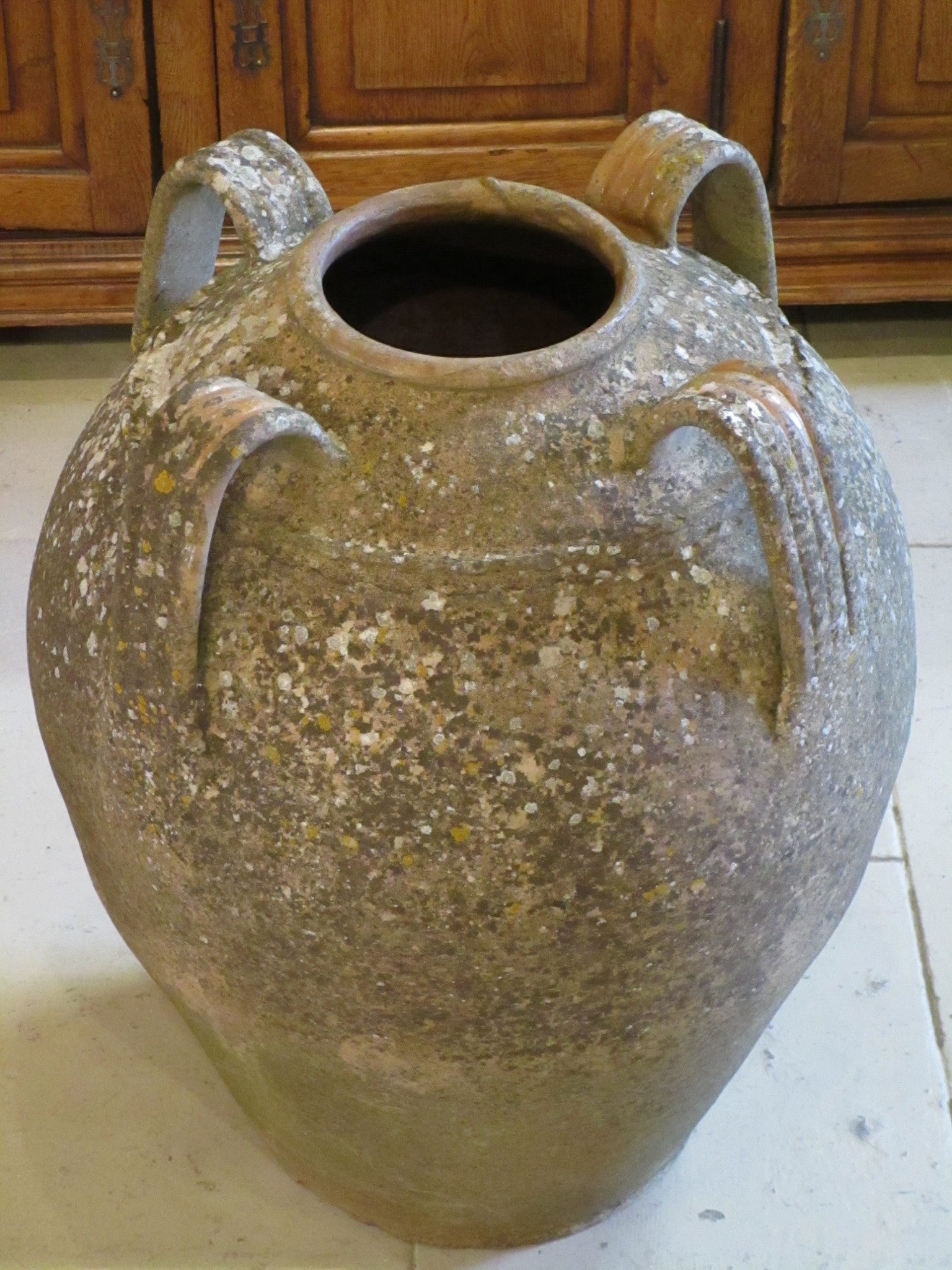 Rustic weathered garden pot with four handles