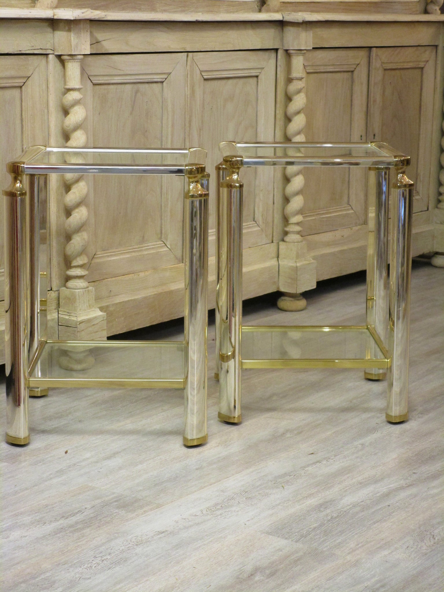 Pair of silver and gold French side tables glass shelves