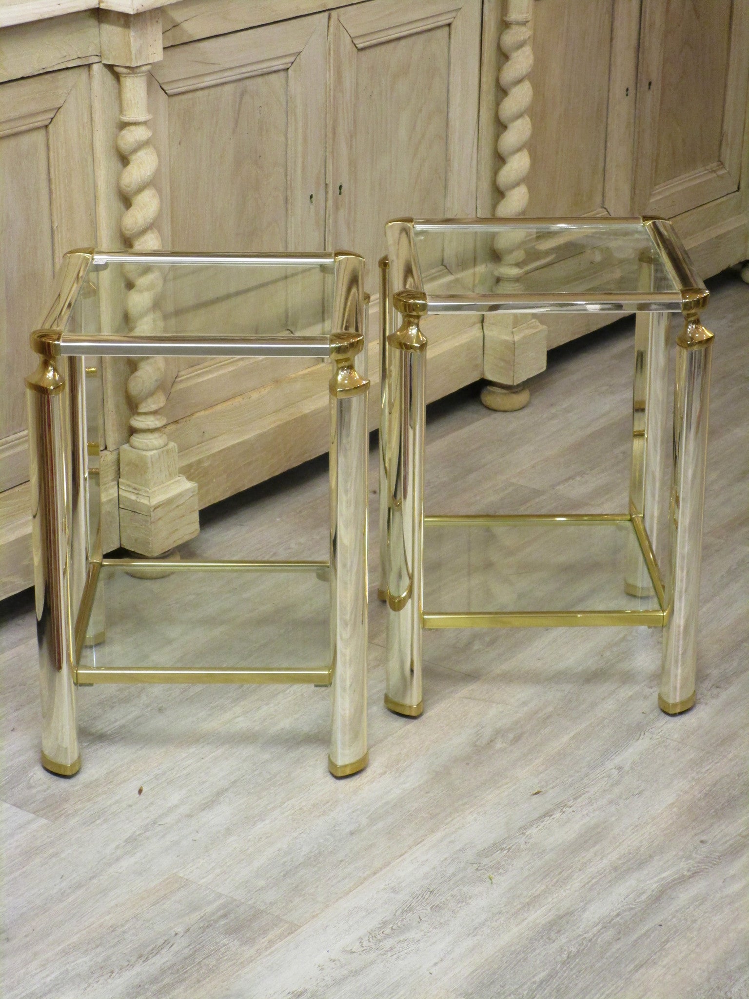 Pair of silver and gold French side tables glass shelves