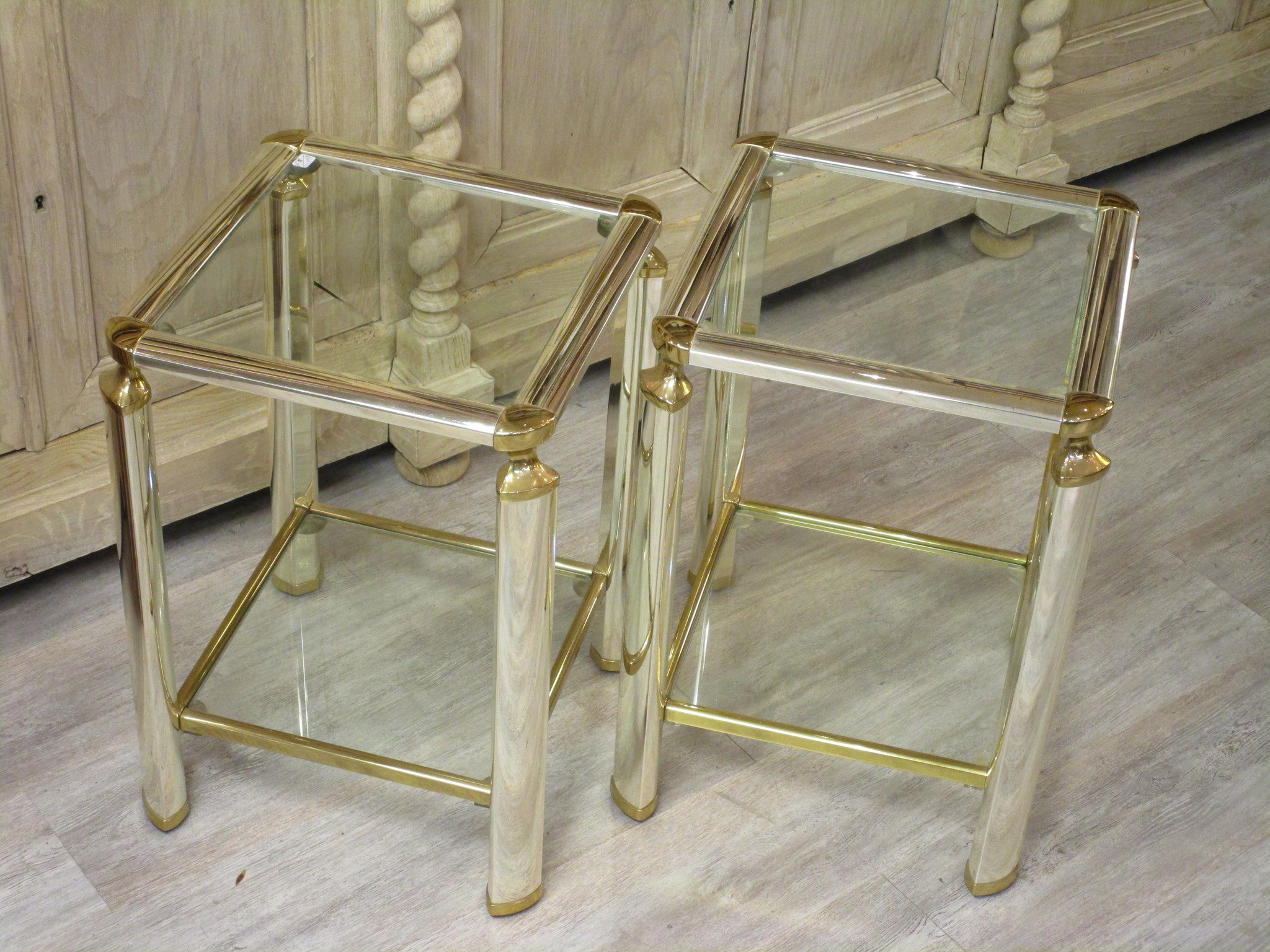 Pair of silver and gold French side tables glass shelves